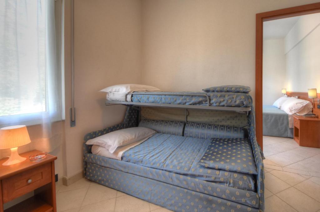 Кровать или кровати в номере Hotel Noris