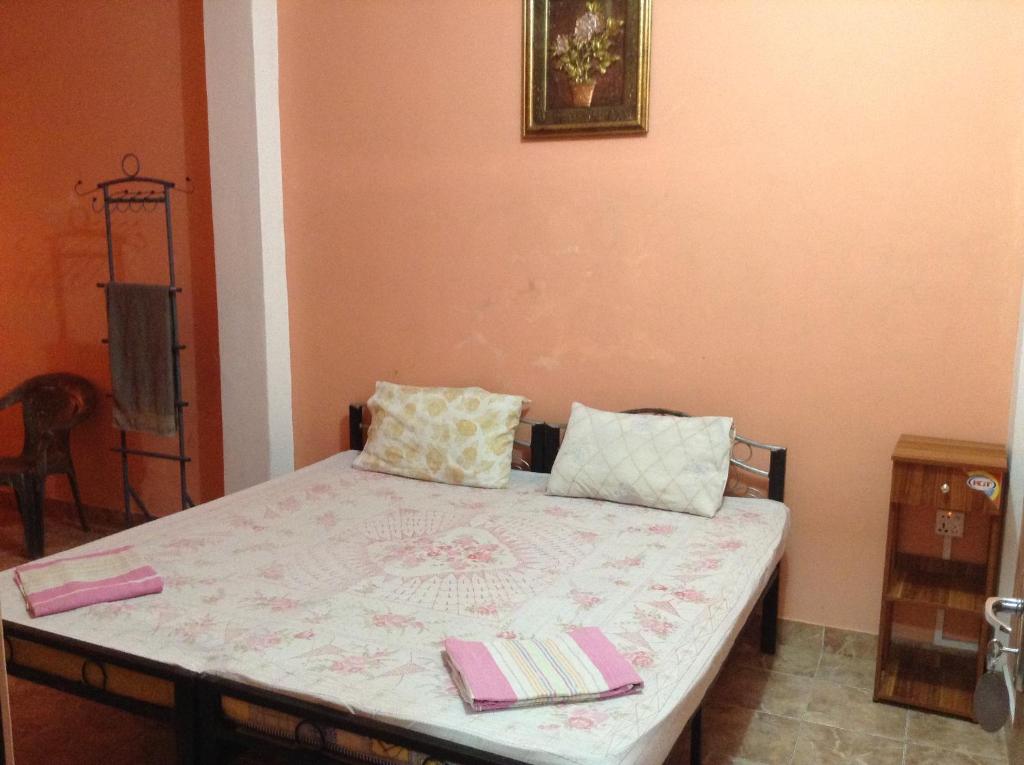 Postel nebo postele na pokoji v ubytování Sunshine Hotel