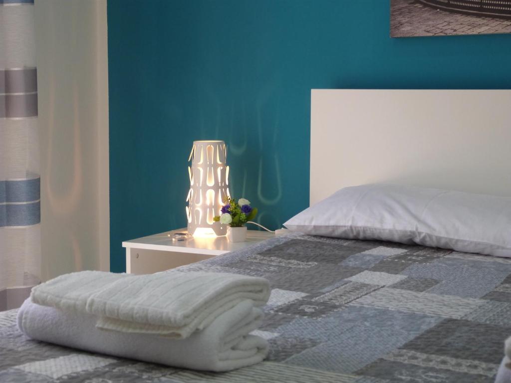 A bed or beds in a room at Casa Principe Maqueda