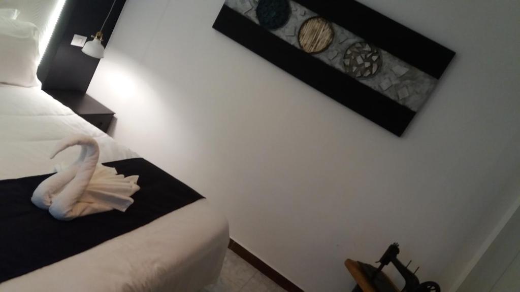 Posteľ alebo postele v izbe v ubytovaní Hotel Raphael