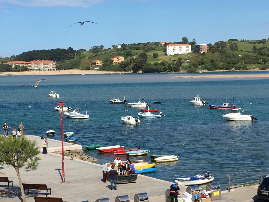 a group of boats in a large body of water at Garelly 2 in San Vicente de la Barquera