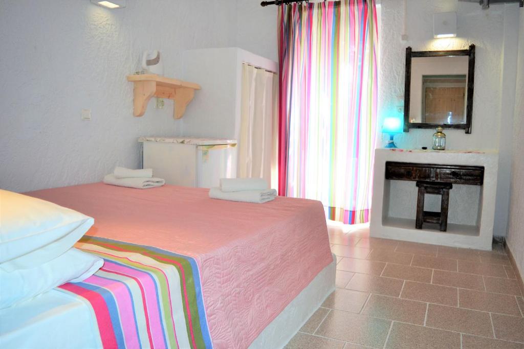 Postel nebo postele na pokoji v ubytování Hotel Irini