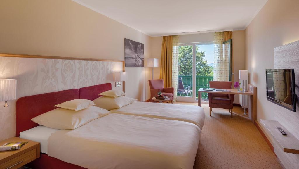 Postel nebo postele na pokoji v ubytování Hotel Sonnengut Wellness - Therme - Spa