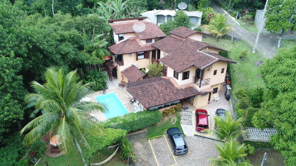 an aerial view of a house with a swimming pool at Vila São Pedro in Ilhabela