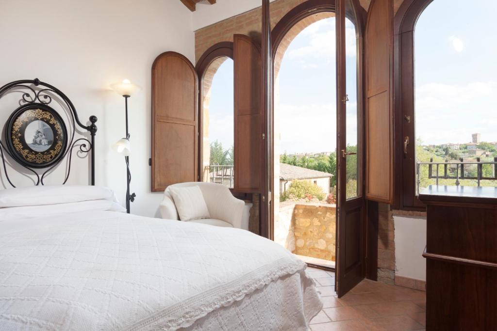Postel nebo postele na pokoji v ubytování Agriturismo La Collina