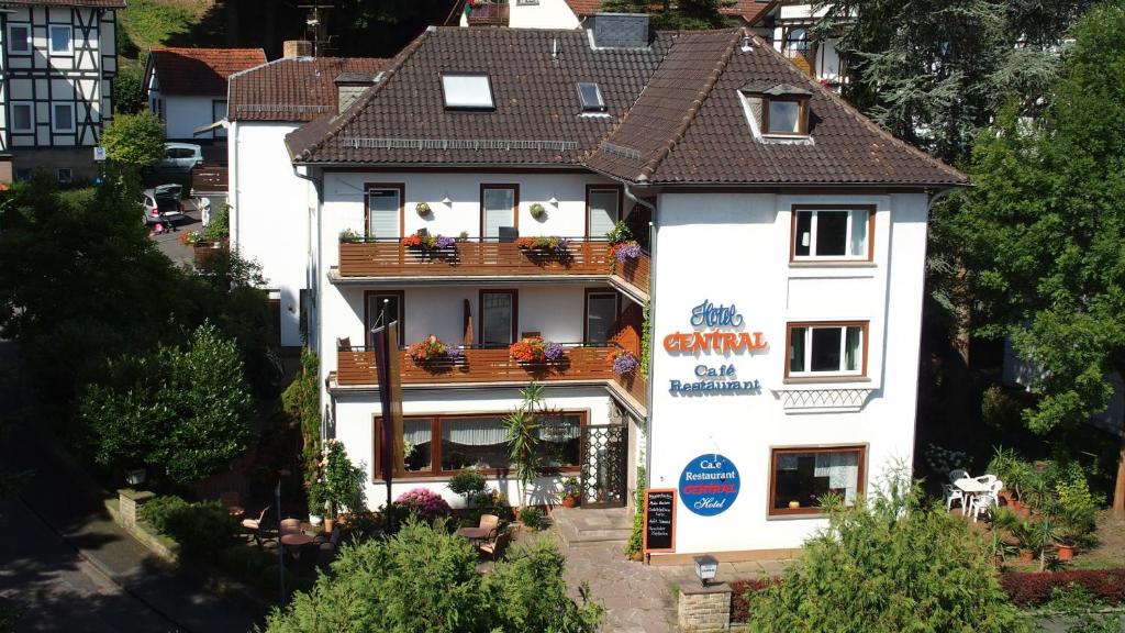 an aerial view of a white building with a balcony at Hotel Central in Bad Sooden-Allendorf