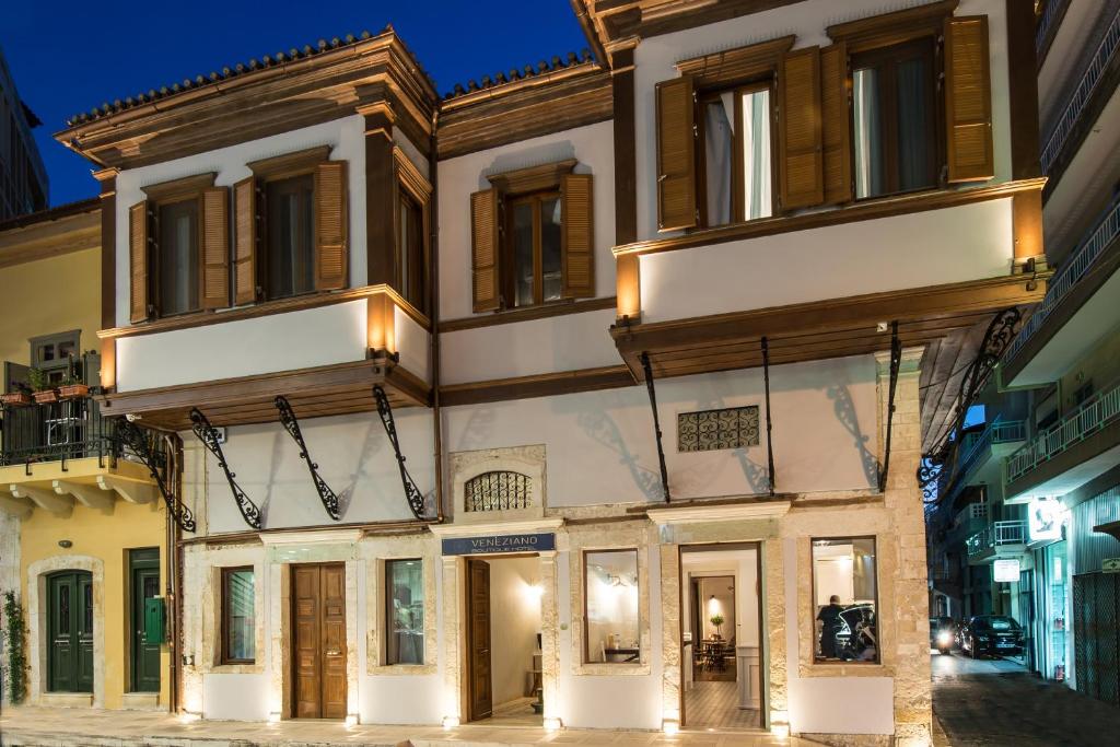 a building on a street at night at Veneziano Boutique Hotel in Heraklio