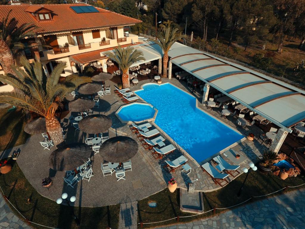 an aerial view of a resort with a swimming pool at Vergos Hotel in Vourvourou