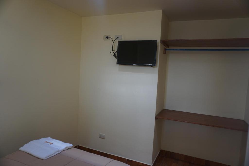 TV a/nebo společenská místnost v ubytování Residencial Mamamia