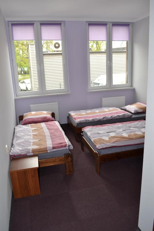 Postel nebo postele na pokoji v ubytování Hostel Mikołajczyka59