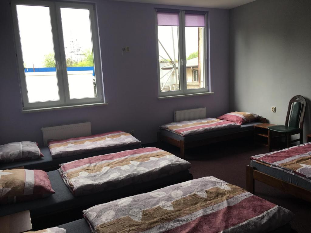 Postel nebo postele na pokoji v ubytování Hostel Mikołajczyka59