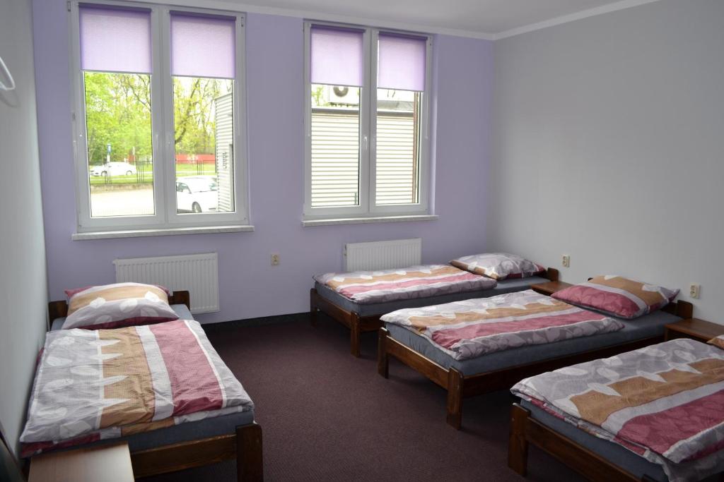 Postel nebo postele na pokoji v ubytování Hostel Mikołajczyka59