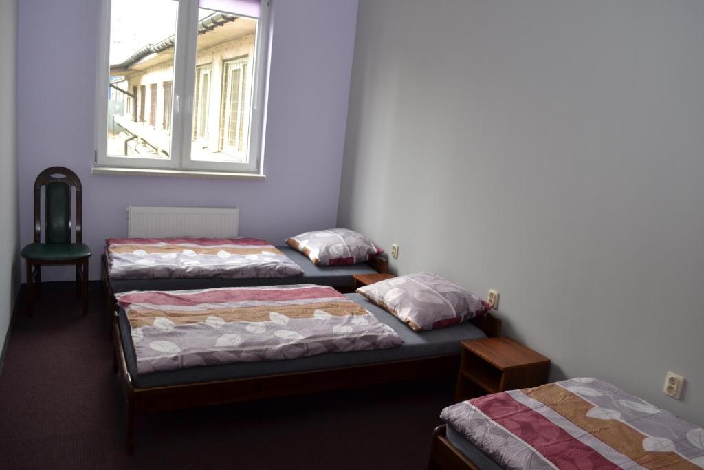 Postel nebo postele na pokoji v ubytování Hostel Mikołajczyka59