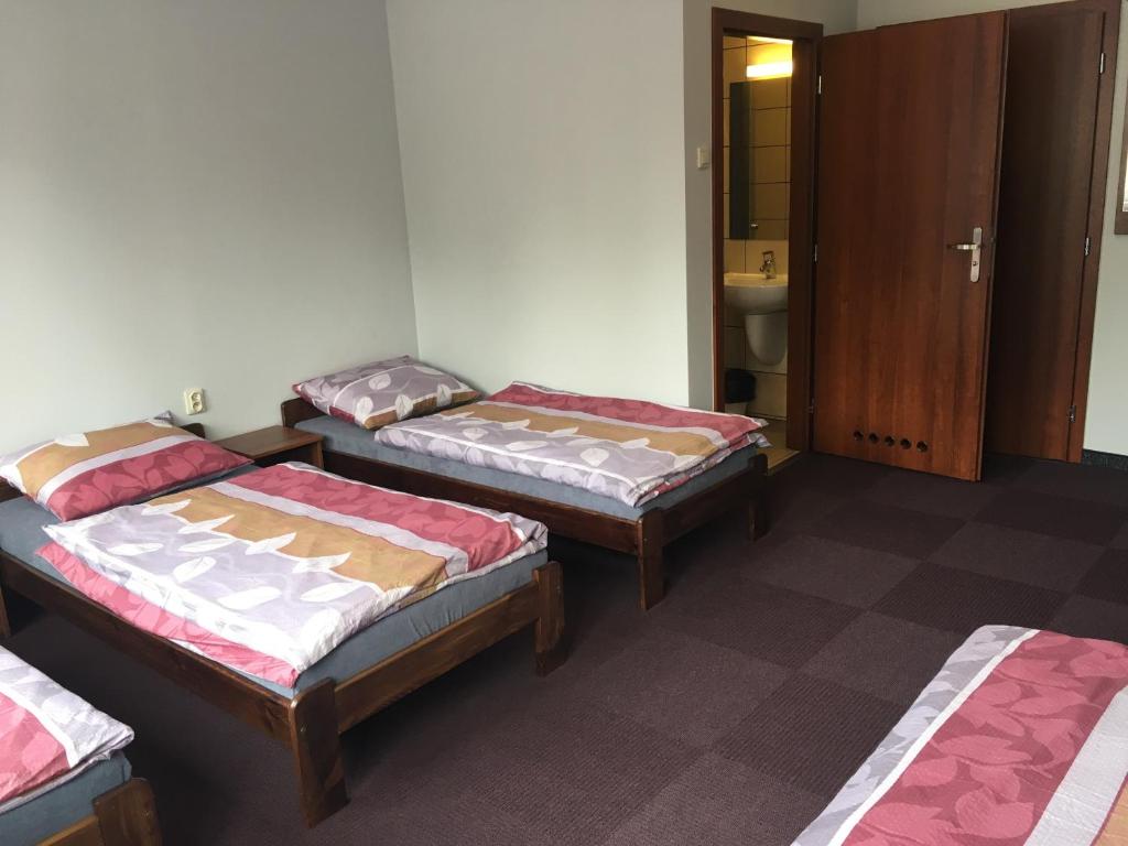Postel nebo postele na pokoji v ubytování Hostel Mikołajczyka59