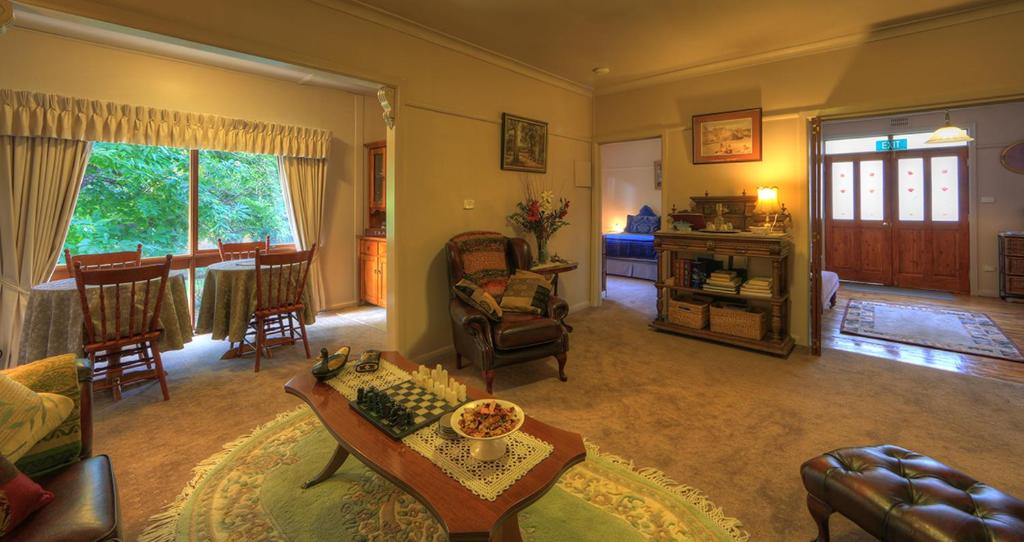 a living room with a couch and a table at Hillview Oak B&B in Lankeys Creek