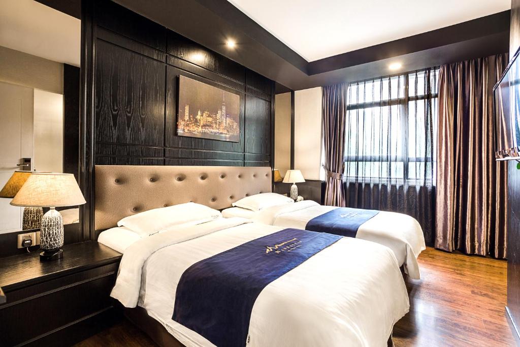 Кровать или кровати в номере Manhattan Business Hotel Damansara Perdana