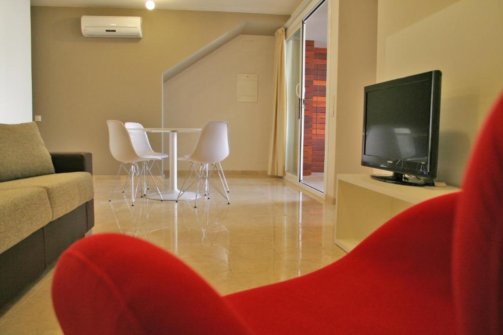 TV a/nebo společenská místnost v ubytování L' Escala Resort