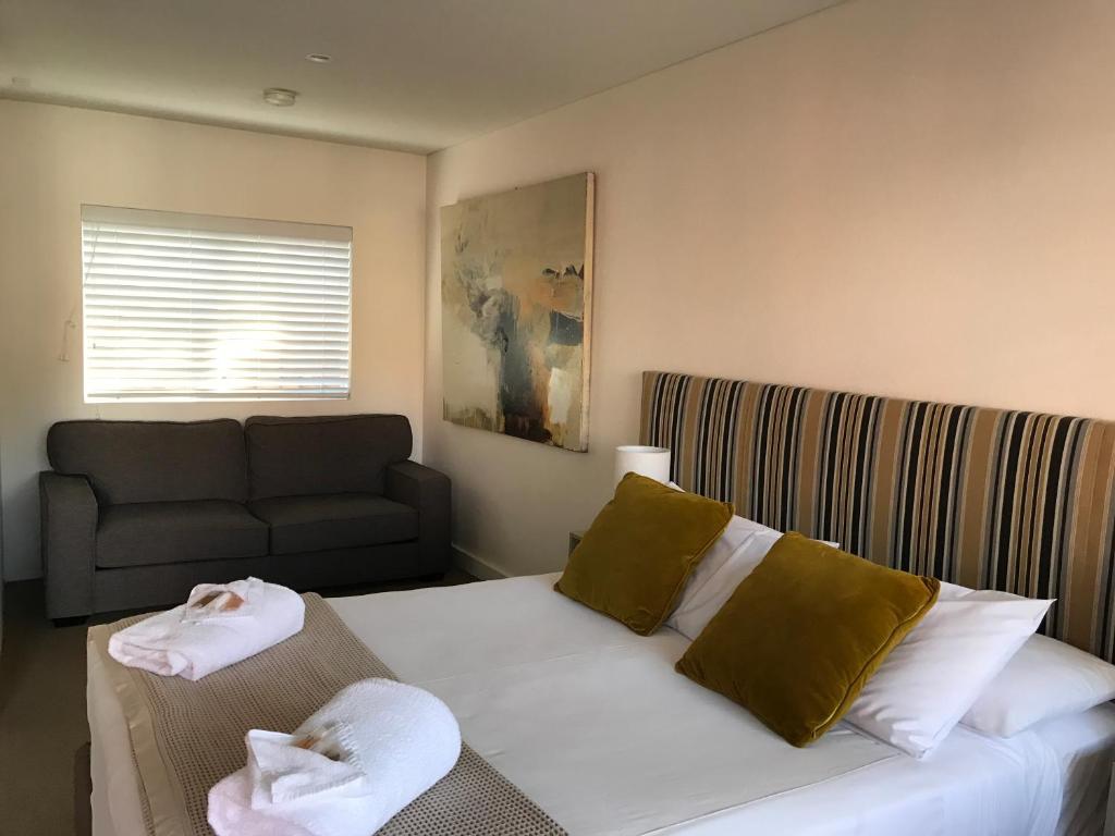 Postel nebo postele na pokoji v ubytování Thirroul Beach Motel