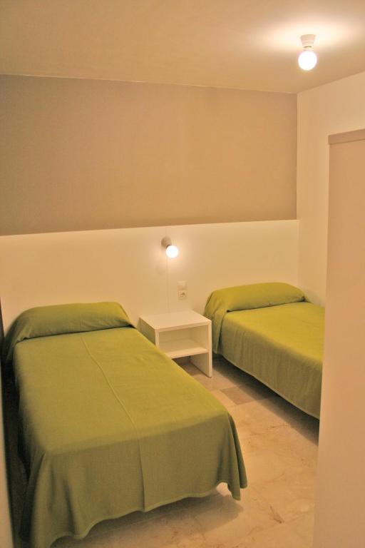Postel nebo postele na pokoji v ubytování L' Escala Resort
