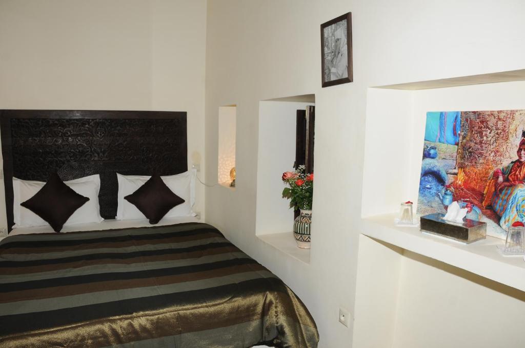 Postel nebo postele na pokoji v ubytování Riad Haraka