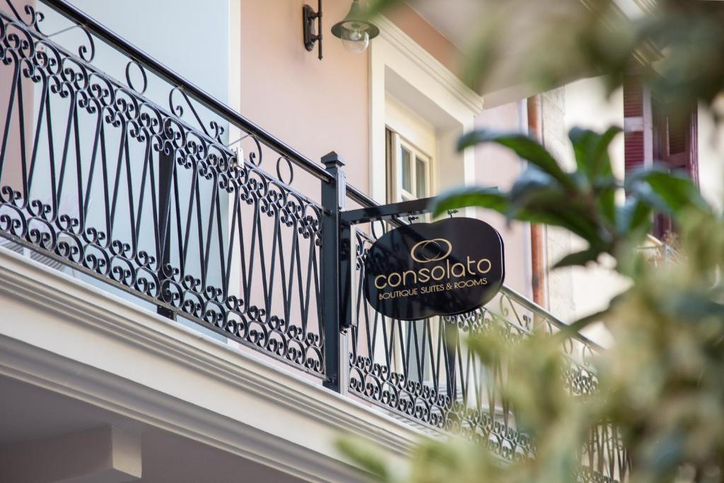 a black balcony with a sign on it at Consolato Boutique in Chania