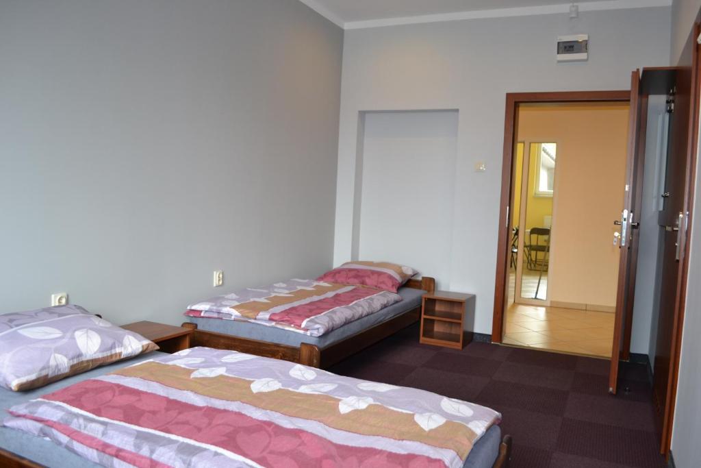 Postel nebo postele na pokoji v ubytování Hostel Mikołajczyka59