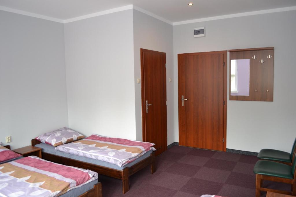Postel nebo postele na pokoji v ubytování Hostel Mikołajczyka59