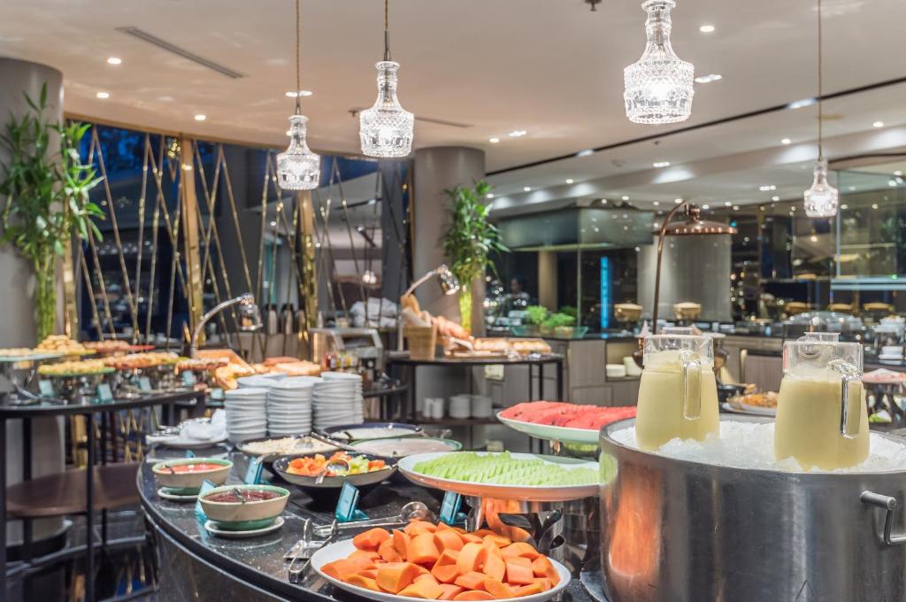 A buffet counter laid out with prepared dishes and drinks.