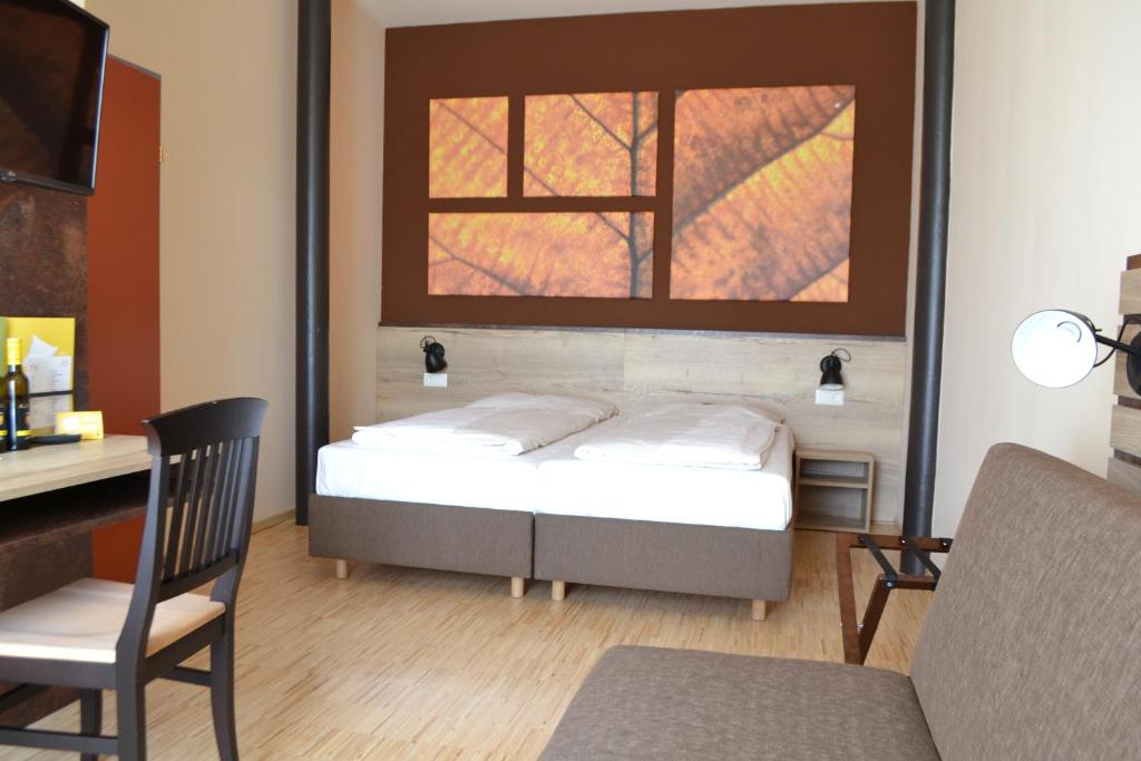 Postel nebo postele na pokoji v ubytování JUFA Hotel Fürstenfeld