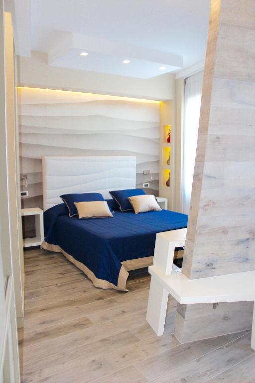 Postel nebo postele na pokoji v ubytování Astoria Hotel