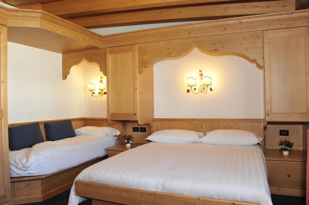 Posteľ alebo postele v izbe v ubytovaní Hotel Negritella