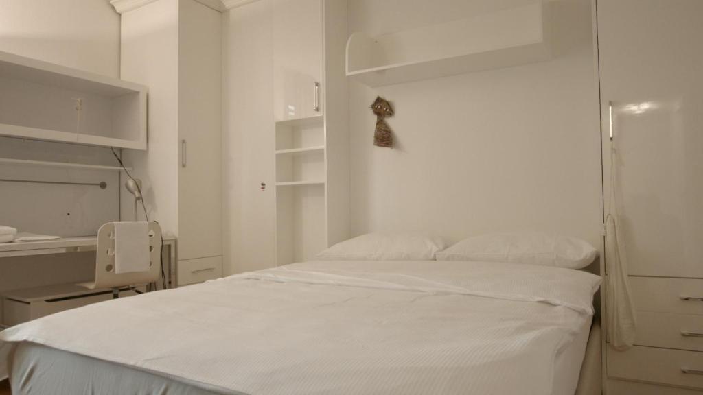 Postel nebo postele na pokoji v ubytování Home by Livingdowntown