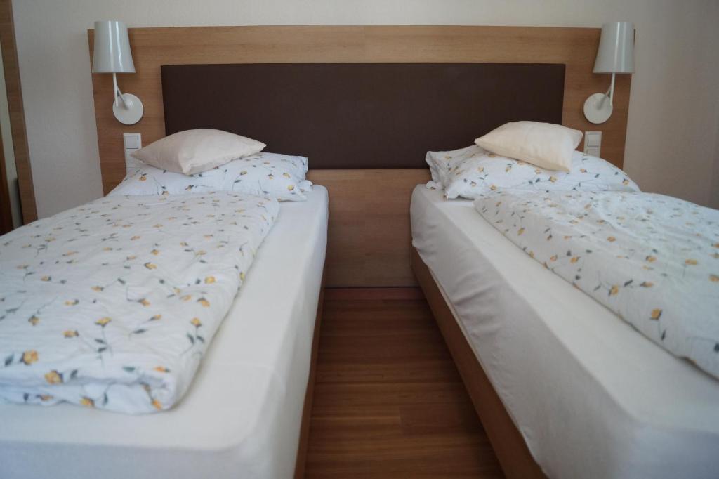 Postel nebo postele na pokoji v ubytování Gasthof zur Traube