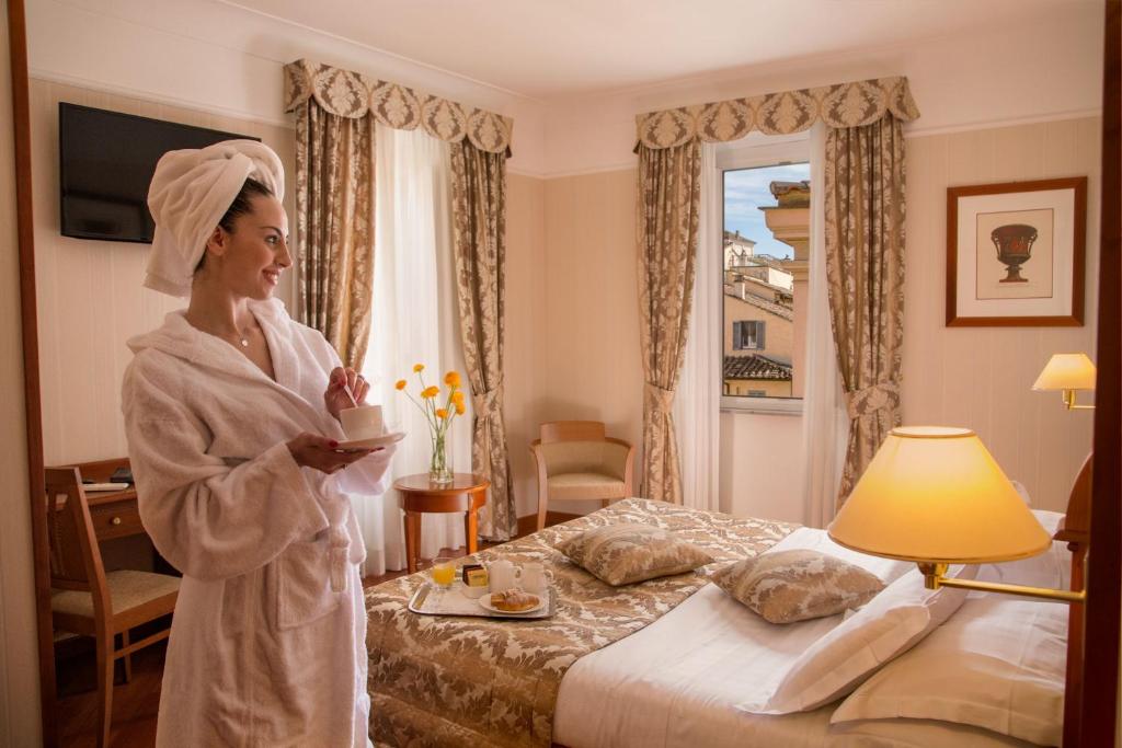Postel nebo postele na pokoji v ubytování Albergo Ottocento