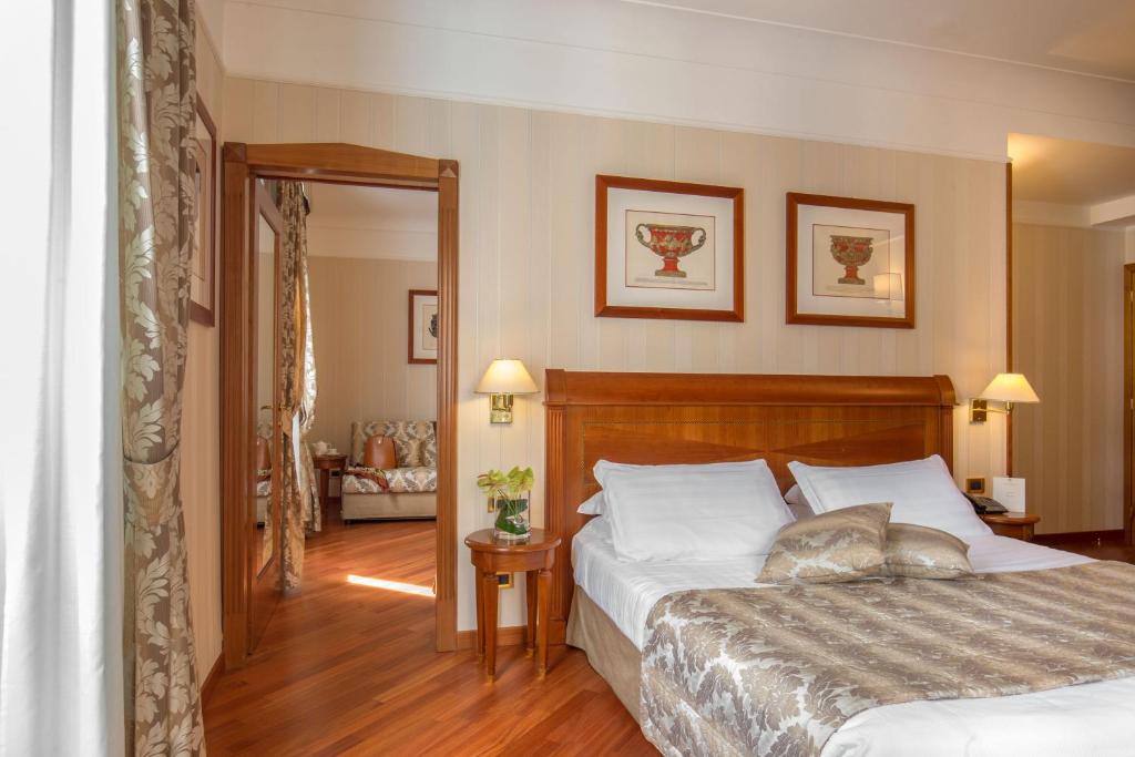 Postel nebo postele na pokoji v ubytování Albergo Ottocento