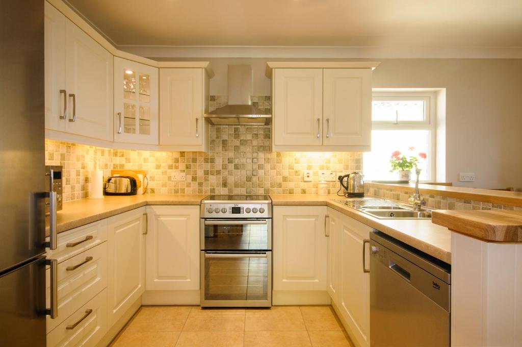 Kuchyň nebo kuchyňský kout v ubytování Seabreeze Apartment