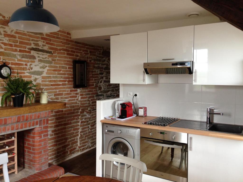 Kuchyň nebo kuchyňský kout v ubytování Le Duplex des Eclusiers