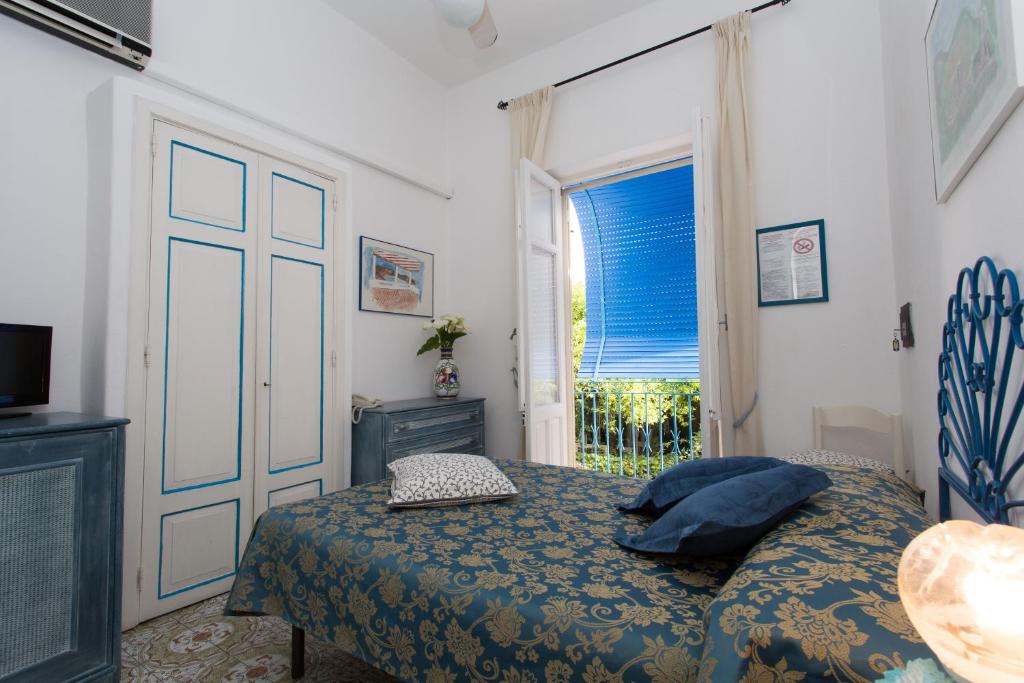 Postel nebo postele na pokoji v ubytování Hotel Poseidon