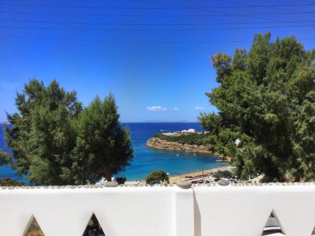 a view of the ocean from a balcony at Mama's Pension in Agios Stefanos