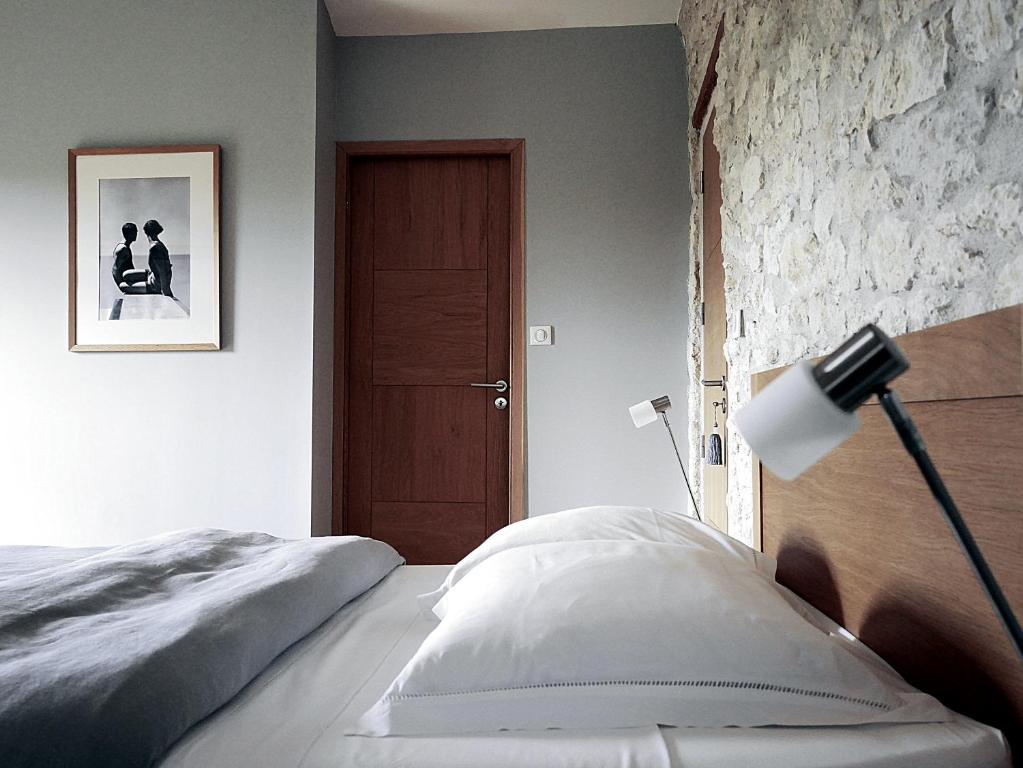 Postel nebo postele na pokoji v ubytování La Bastide