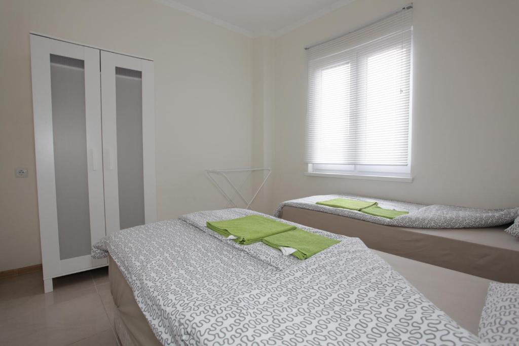 Postel nebo postele na pokoji v ubytování Sukhum City Mini Hotel