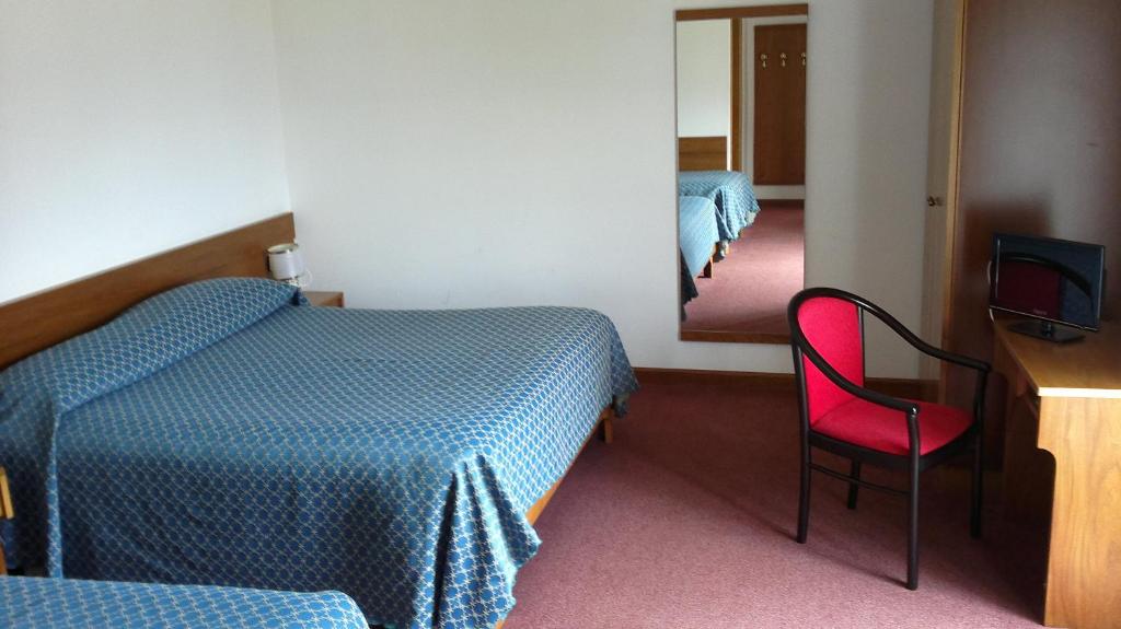 Postel nebo postele na pokoji v ubytování Hotel Serenella