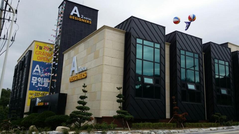 a building with a sign on top of it at A2 Hotel Desingers in Yesan