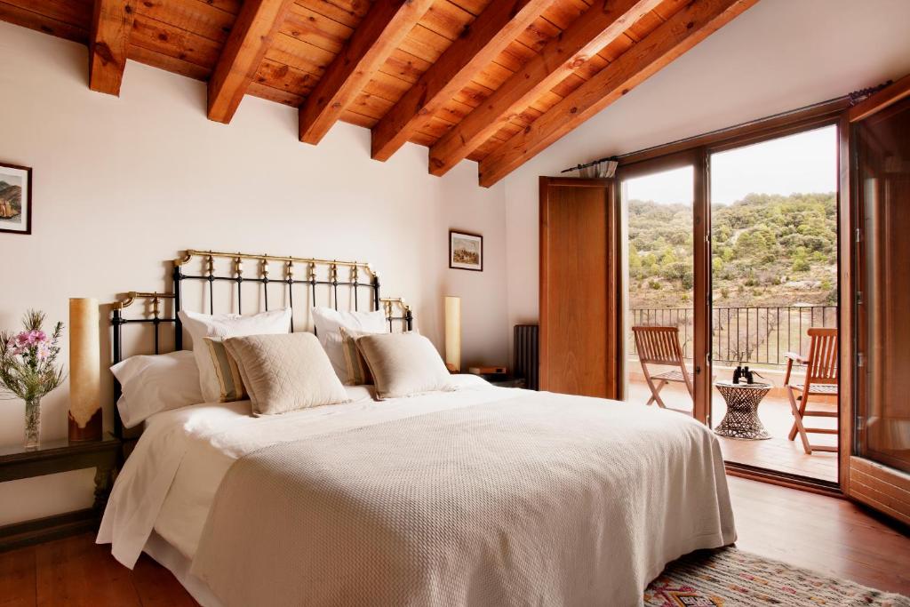 Postel nebo postele na pokoji v ubytování Hotel Mas de la Serra