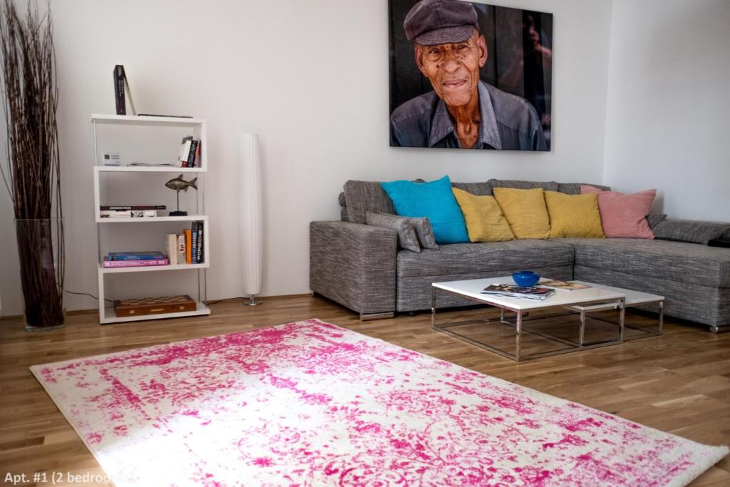 a living room with a couch and a table at Boutique Apartments Vienna in Vienna