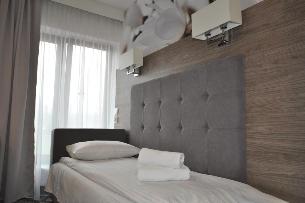 Posteľ alebo postele v izbe v ubytovaní Pass Hotel