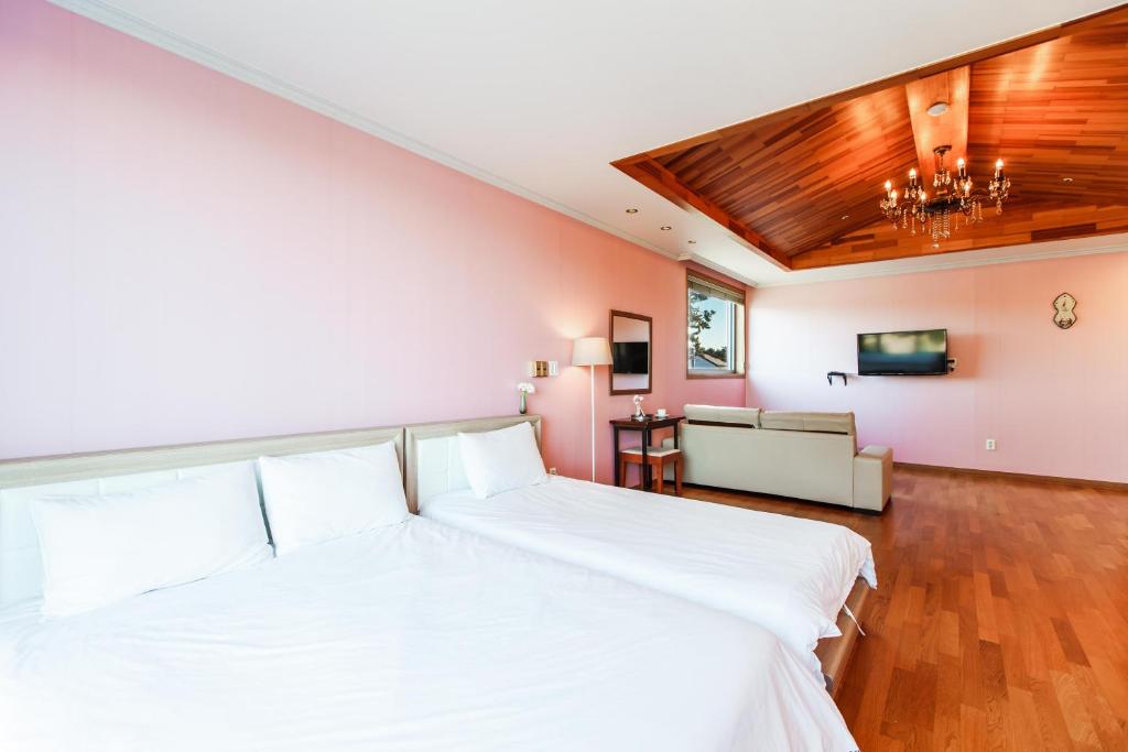 Postel nebo postele na pokoji v ubytování Harmony Resort