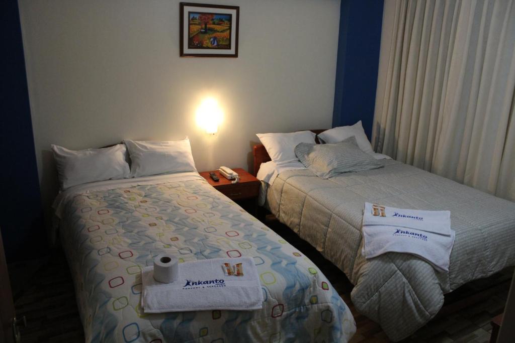 Postel nebo postele na pokoji v ubytování Hostal Inkanto Taruma