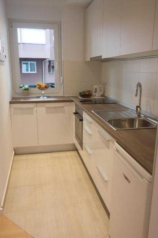 Kuchyň nebo kuchyňský kout v ubytování Paula Apartment