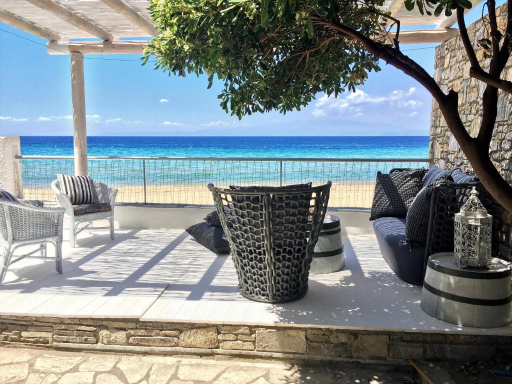 a patio with a view of the ocean at Byblos Mare in Skala Sotiros
